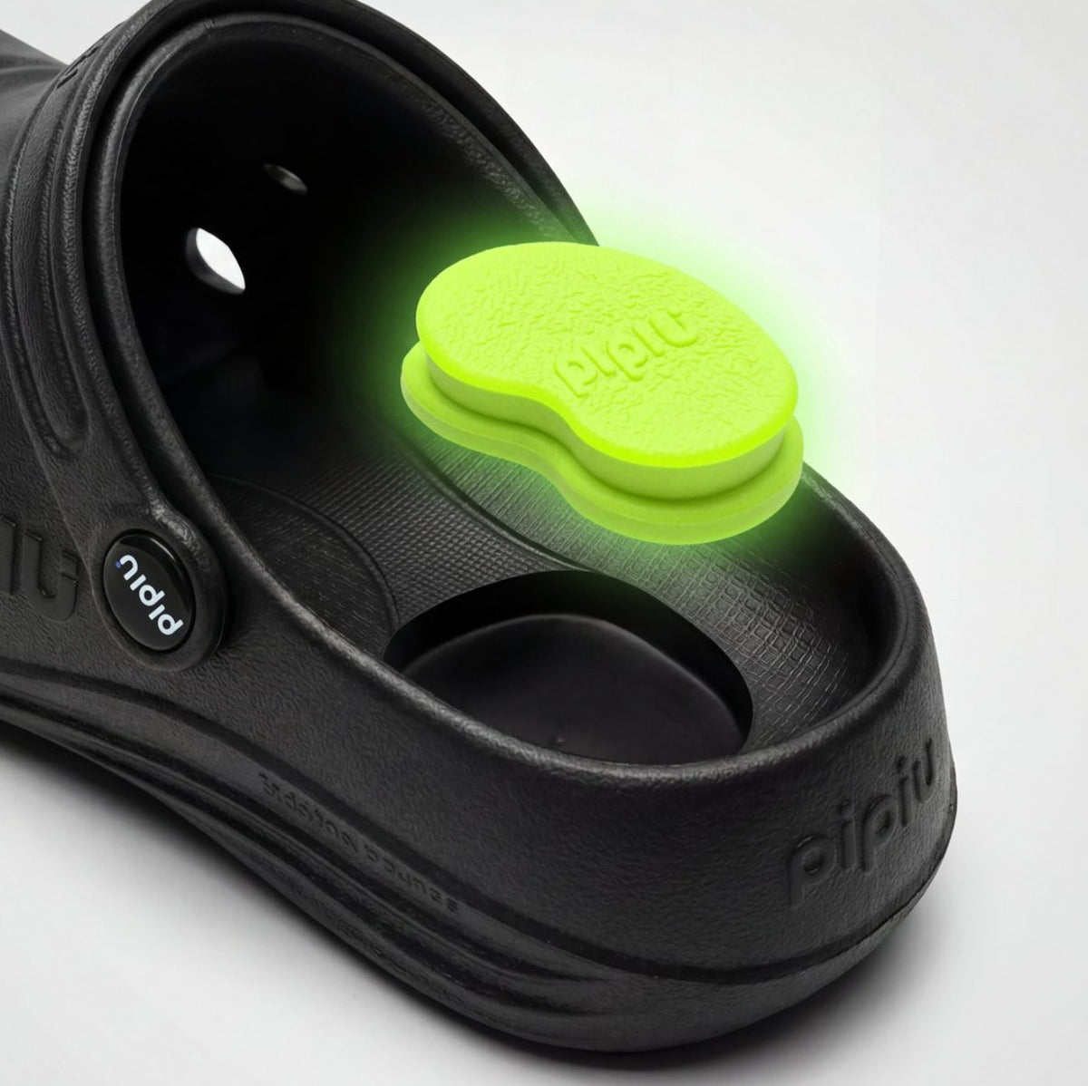 Black PIPU clog with a lime peanut-shaped heel pad