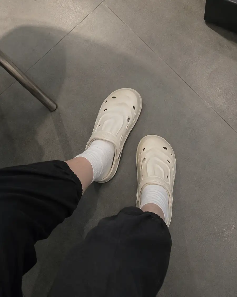 Reviewer wearing ivory pipiu clogs with white socks